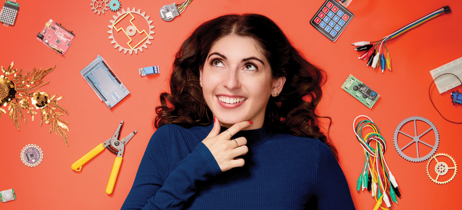 Christina Ernst surrounded by engineering parts
