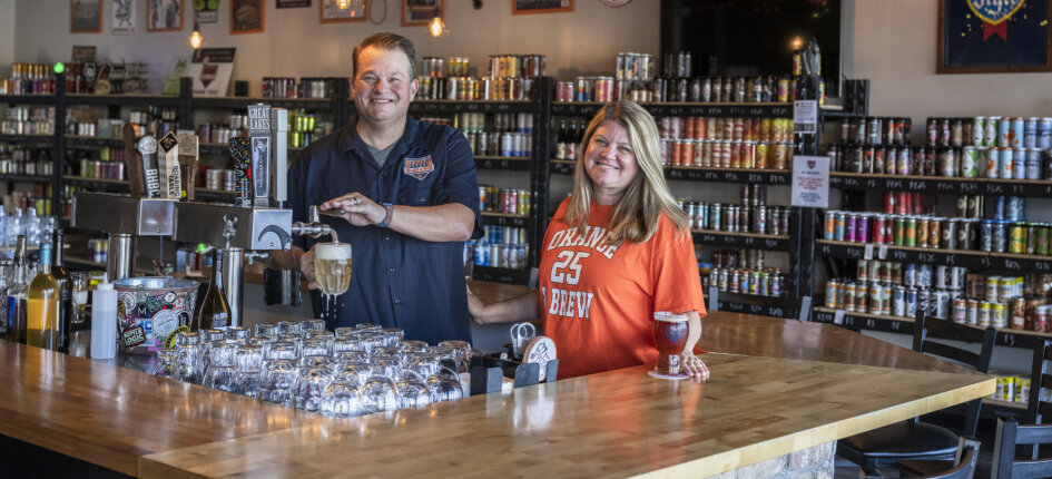 Eric and Carrie Schmidt behind the bar