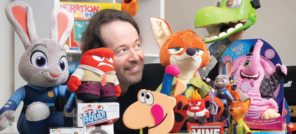 Michael Lichodziejewski poses with toys