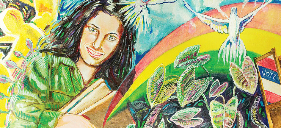 Colorful mural of a female student holding books among plants with a rainbow and "vote" sign.