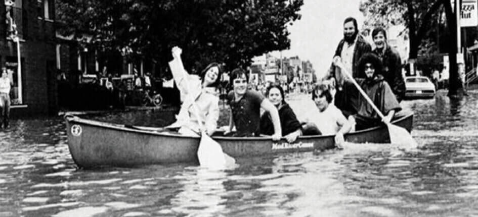 People canoeing on a flooded street
