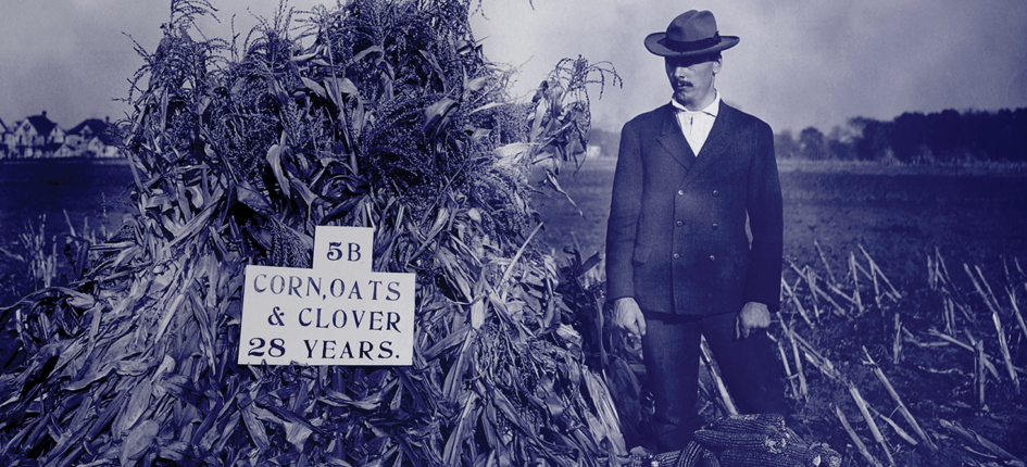 historic image of a man in a crop field