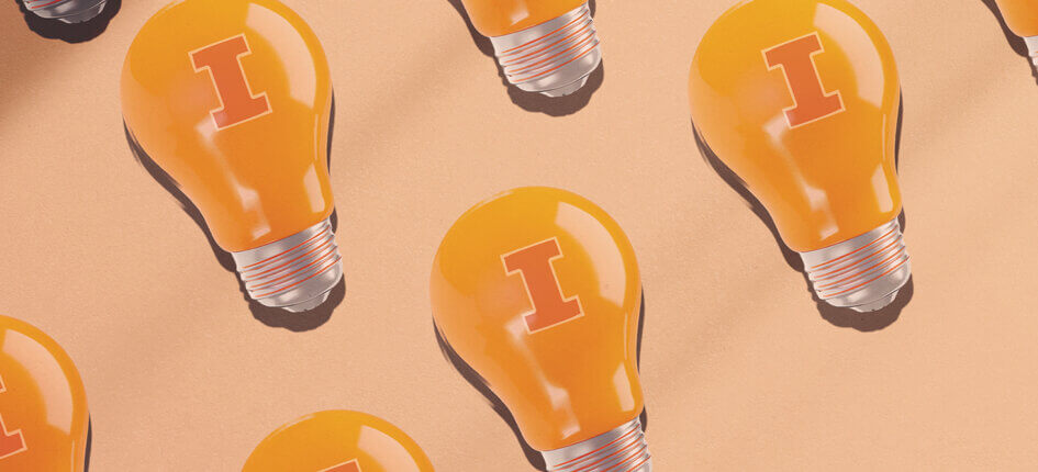 Lightbulbs with block I printed on them on orange pastel colored background
