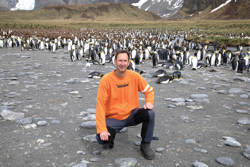 Robert P. Harris among penguins in Antarctica