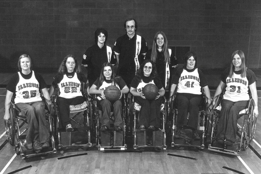 Susan Hagel with her 1954-75 basketball team, posed on the court.