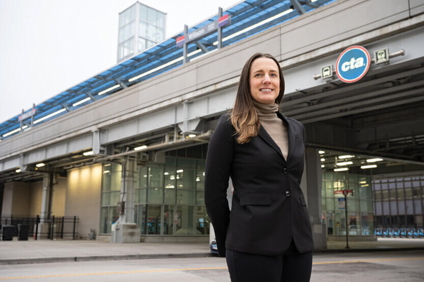 Mary Lou Kutska standing in front of the Wilson Red Line train station.