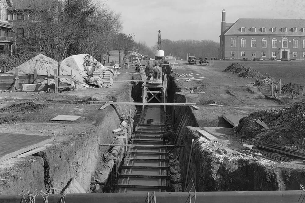 Black and white shot of a big trench in the ground