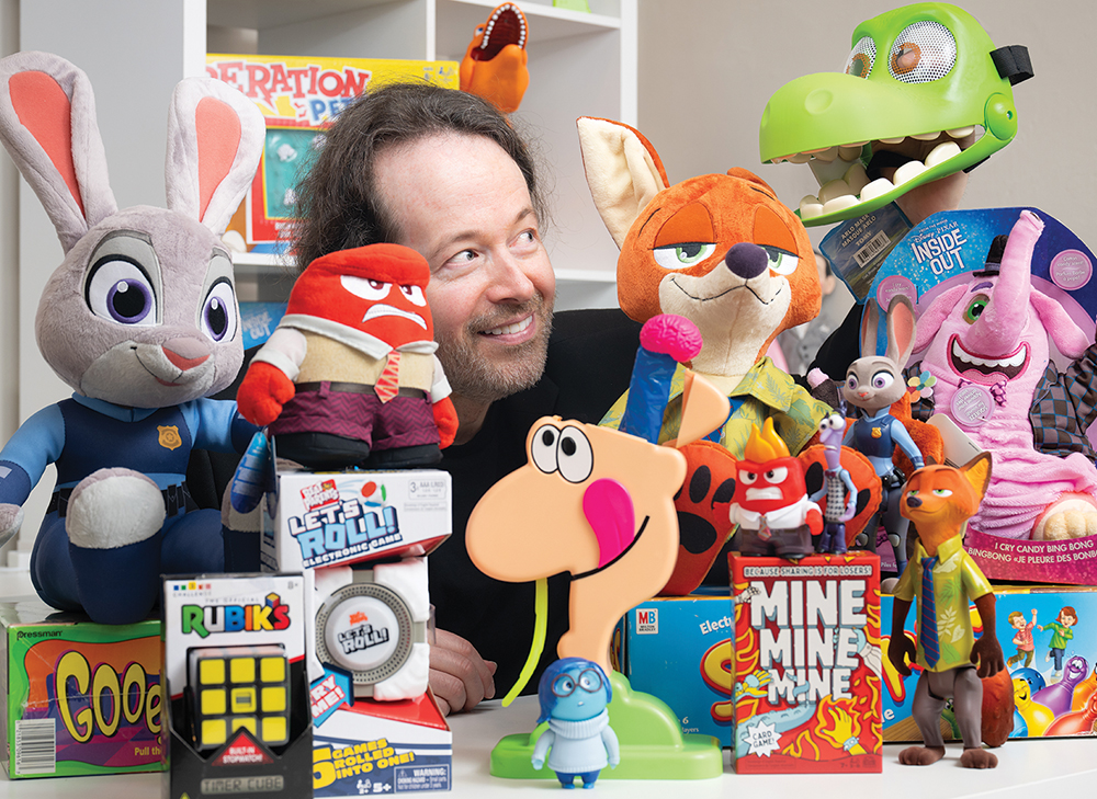 Michael Lichodziejewski poses with toys