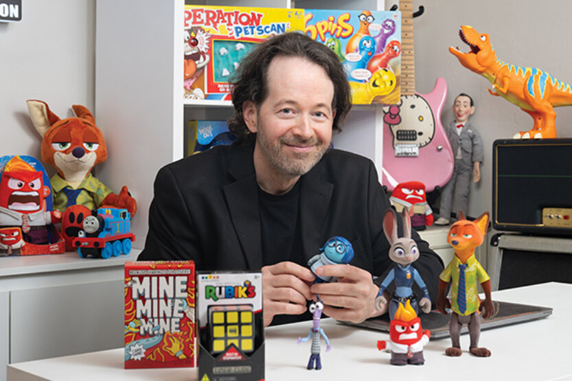 Michael Lichodziejewski poses with toys