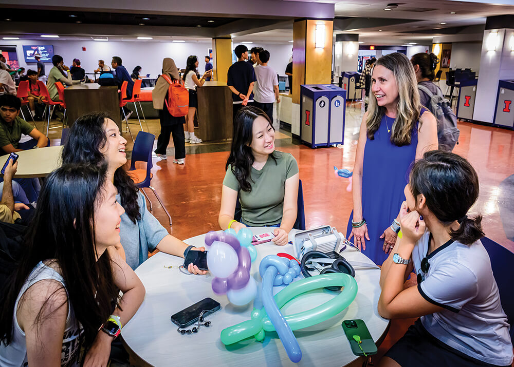 Becki Salzman talking to students in the rec center