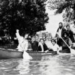 People canoeing on a flooded street