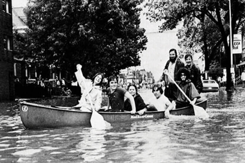 People canoeing on a flooded street