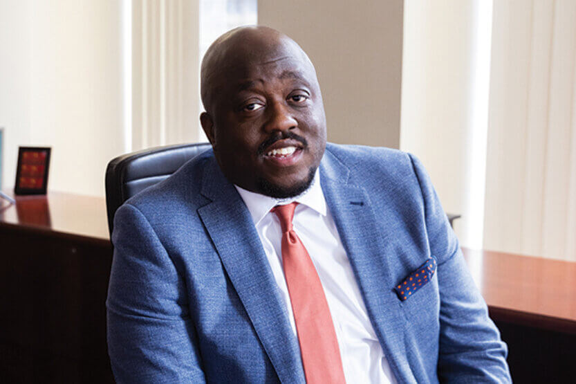 Sharone Mitchell seated in his office