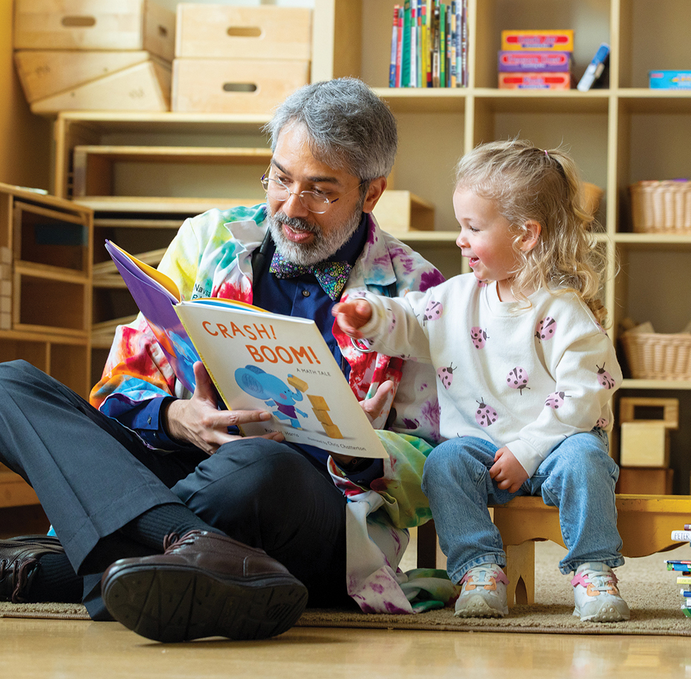 Dipesh Navsaria reading a book to a child