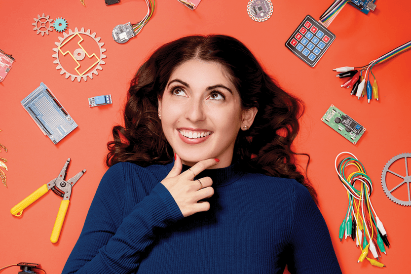 Christina Ernst surrounded by engineering parts